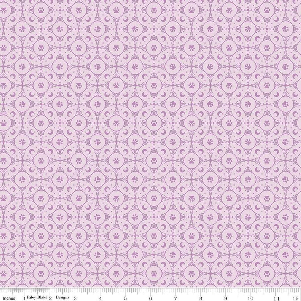 Image of Celtic Cats Circle Paws Lilac quilting cotton fabric by Brigid Ashwood for Riley Blake Designs. Features pawprints on a purple background. Cute Little Fabric Shop