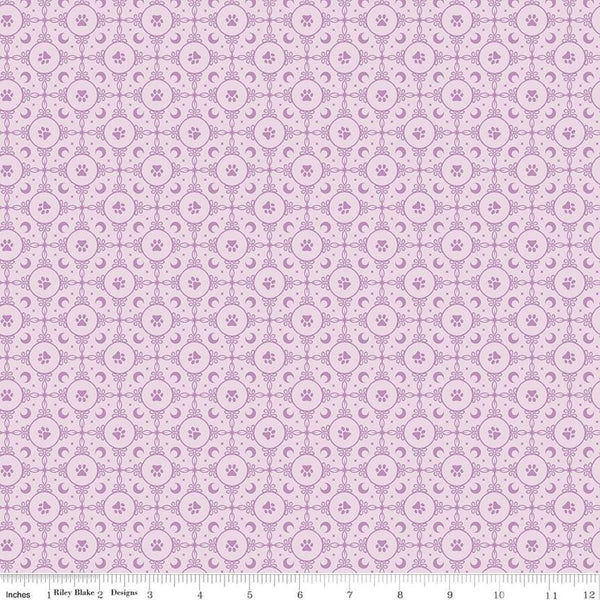 Image of Celtic Cats Circle Paws Lilac quilting cotton fabric by Brigid Ashwood for Riley Blake Designs. Features pawprints on a purple background. Cute Little Fabric Shop