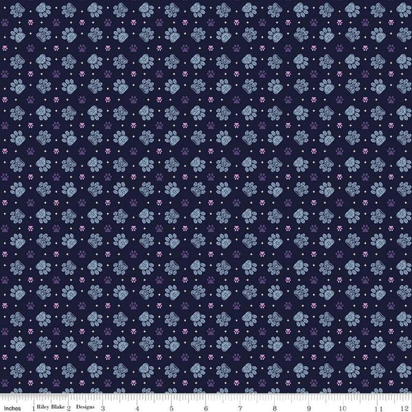 Image of Celtic Cats Paws Nighttime quilting cotton fabric by Brigid Ashwood for Riley Blake Designs. Features pawprints on a black background. Cute Little Fabric Shop