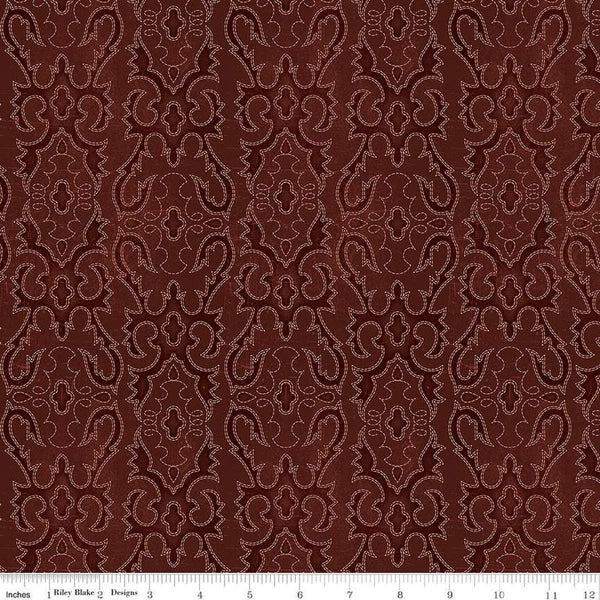 Image of John Wayne American West Boot Stitching Marsala quilting cotton fabric by Riley Blake Official Product for Riley Blake Designs. Features printed embroidery on a red background. Cute Little Fabric Shop