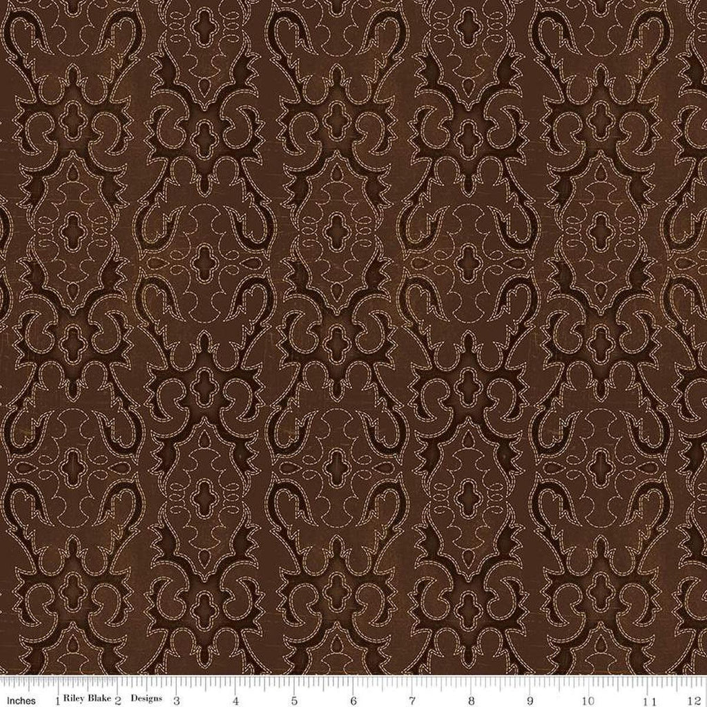 Image of John Wayne American West Boot Stitching Brown quilting cotton fabric by Riley Blake Official Product for Riley Blake Designs. Features printed embroidery on a brown background. Cute Little Fabric Shop