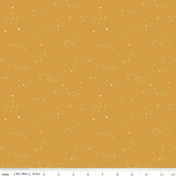 Image of Essence Starlight Golden quilting cotton fabric by Fran Gulick for Riley Blake Designs. Features stars on a yellow background. Cute Little Fabric Shop