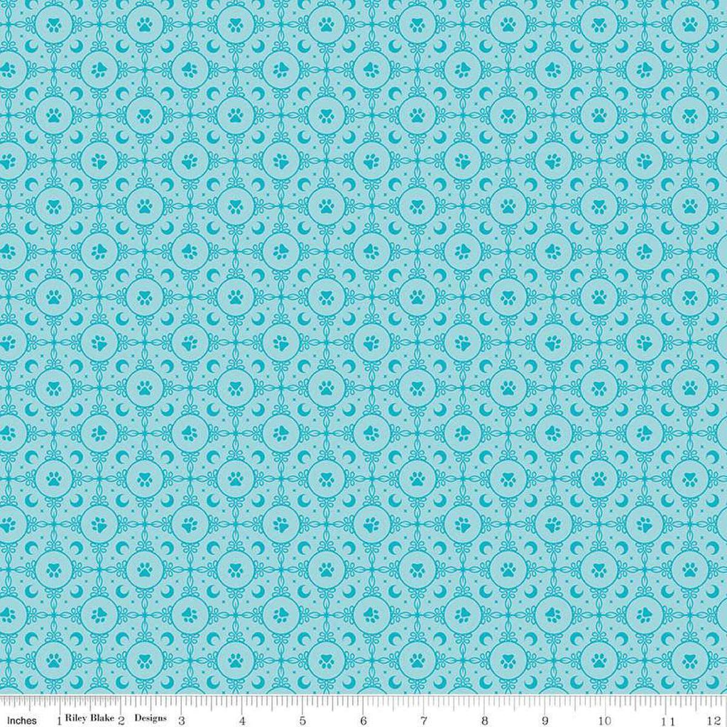 Image of Celtic Cats Circle Paws Aqua quilting cotton fabric by Brigid Ashwood for Riley Blake Designs. Features pawprints on a blue background. Cute Little Fabric Shop