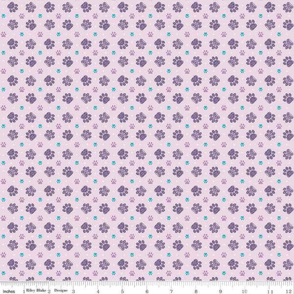 Image of Celtic Cats Paws Lilac quilting cotton fabric by Brigid Ashwood for Riley Blake Designs. Features pawprints on a purple background. Cute Little Fabric Shop