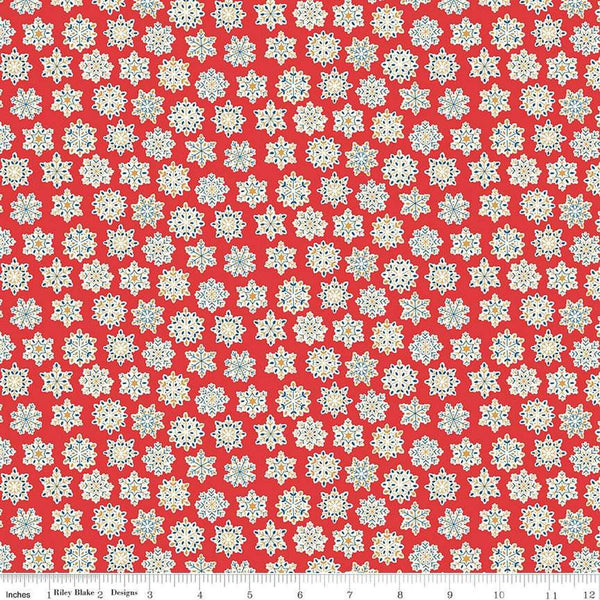 Image of Festive Greetings Snow Season quilting cotton fabric by Liberty Fabrics for Riley Blake Designs. Features snowflakes on a red background. Cute Little Fabric Shop