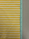 a close up of a yellow and white striped fabric