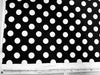 a black and white photo of a polka dot fabric
