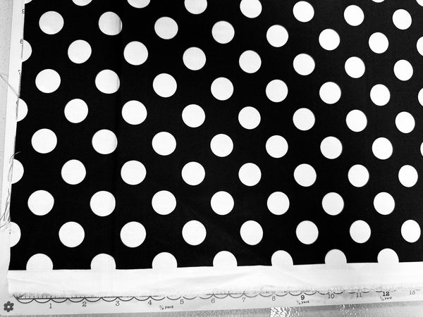 a black and white photo of a polka dot fabric