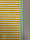 a close up of a yellow and white striped fabric