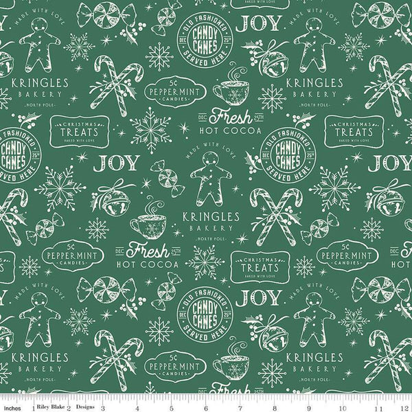 Green quilting cotton fabric with white illustrations of gingerbread men, &quot;Christmas treats&quot; signs, candy canes peppermints, snowflakes, hot cocoa, and more. 
Cute Little Fabric Shop