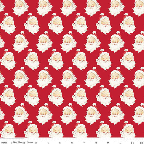 Red quilting cotton with Santa Claus heads with beards, red hats, and a smile. 
Cute Little Fabric Shop