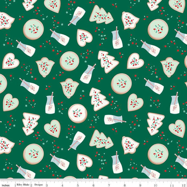 Green fabric with circle, heart, bell, and tree shaped cookies, cups of milk with straws, and sprinkles.
Cute Little Fabric Shop