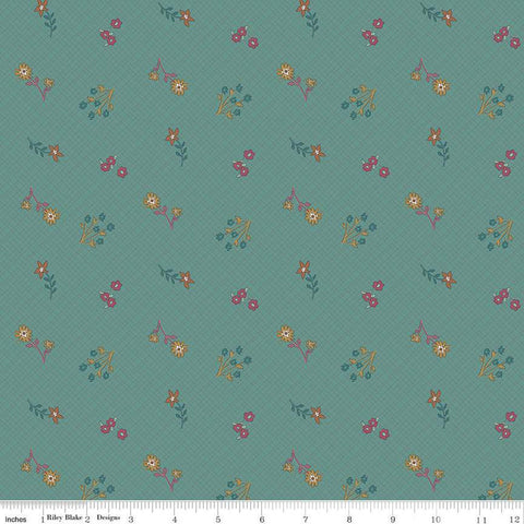 River, teal colored quilting cotton fabrics with light grid lines on the background and scattered pink, teal, and yellow flowers. 
Cute Little Fabric Shop