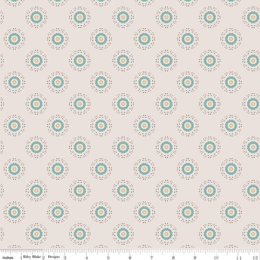 Linen, cream, sand colored quilting cotton fabrics with circular floral teal and yellow wreaths. 
Cute Little Fabric Shop