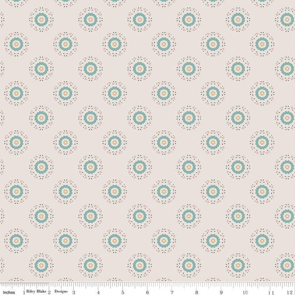 Linen, cream, sand colored quilting cotton fabrics with circular floral teal and yellow wreaths. 
Cute Little Fabric Shop