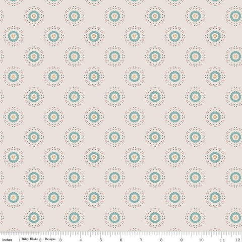 Linen, cream, sand colored quilting cotton fabrics with circular floral teal and yellow wreaths. 
Cute Little Fabric Shop