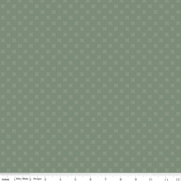 Sage green quilting cotton fabric with squares in a grid. Each square is about 1/4&quot; wide. There are white X&#39;s within the squares
Cute Little Fabric Shop