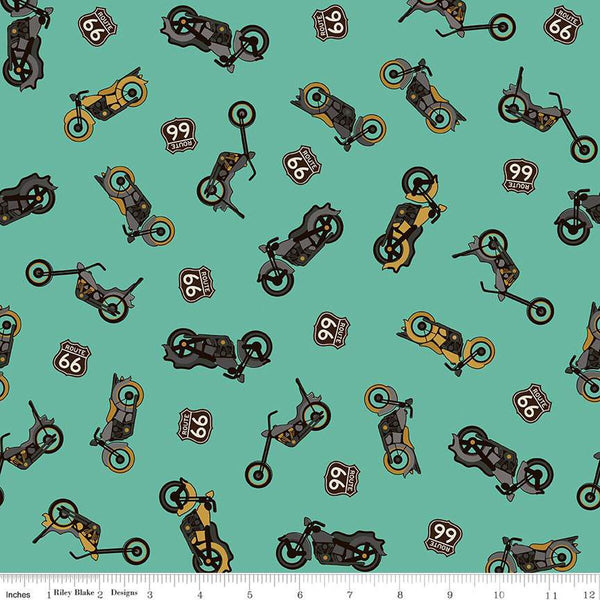 Teal, aqua colored quilting cotton fabric with yellow and gray colored motorcycles, with Route 66 signs. 
Cute Little Fabric Shop