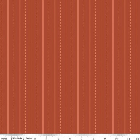 Red, rust colored fabric with dashed lines and stripes on quilting cotton fabric. 
Cute Little Fabric Shop