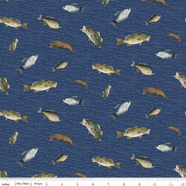 Navy blue colored quilting cotton fabric. Riley Blake Designs Wake at the Lake featuring scattered fish on a dark blue background. 
Cute Little Fabric Shop