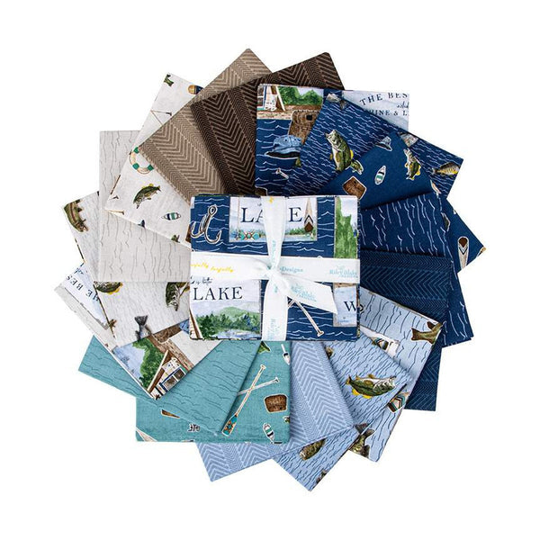 Fat quarter bundle from the Wake at the Lake collection by Riley Blake Designs. Pictures a 16 piece fat quarter bundle with mainly blue, cream, and brown fabrics surrounding it in a spiral. 
Cute Little Fabric Shop