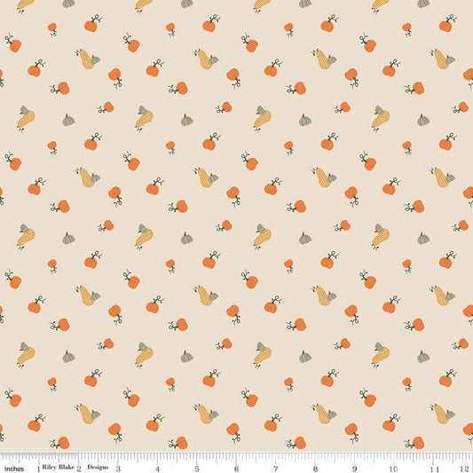 Image of ivory, cream colored quilting cotton fabric for the Pumpkin Spice collection by Riley Blake Designs. Features scattered and tossed orange, yellow, and green pumpkins on the olive background. 
Cute Little Fabric Shop