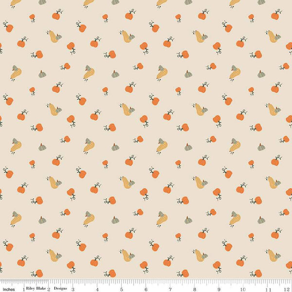 Image of ivory, cream colored quilting cotton fabric for the Pumpkin Spice collection by Riley Blake Designs. Features scattered and tossed orange, yellow, and green pumpkins on the olive background. 
Cute Little Fabric Shop