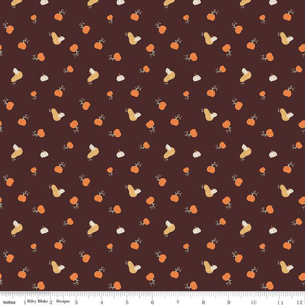 Image of espresso brown colored quilting cotton fabric for the Pumpkin Spice collection by Riley Blake Designs. Features scattered and tossed orange, yellow, and cream pumpkins on the espresso background. 
Cute Little Fabric Shop