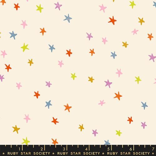 Image of Moda Fabrics Starry Multi fabric. Features scattered pink, orange, red, blue, green, and yellow stars on a cream background. 
Cute Little Fabric Shop