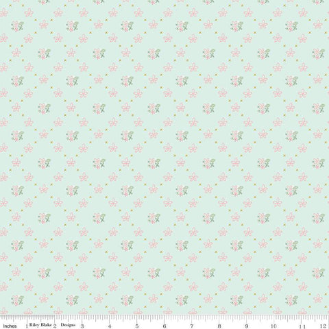 Clover Farm from Riley Blake Designs. Image depicts scattered flowers and Xs on a light blue background. Quilting cotton fabric. 
Cute Little Fabric Shop