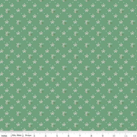 Clover Farm from Riley Blake Designs. Image depicts scattered flowers and Xs on a green background. Quilting cotton fabric. 
Cute Little Fabric Shop