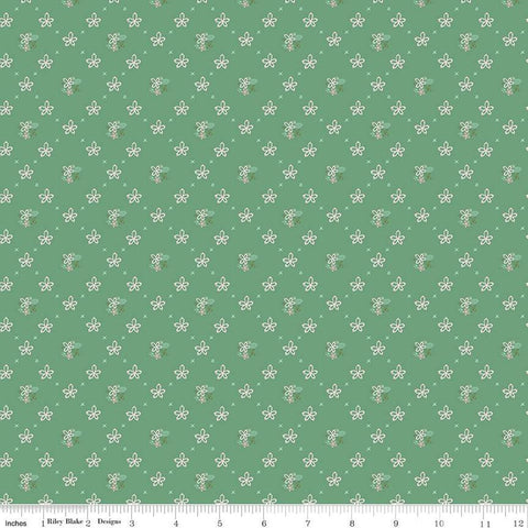 Clover Farm from Riley Blake Designs. Image depicts scattered flowers and Xs on a green background. Quilting cotton fabric. 
Cute Little Fabric Shop