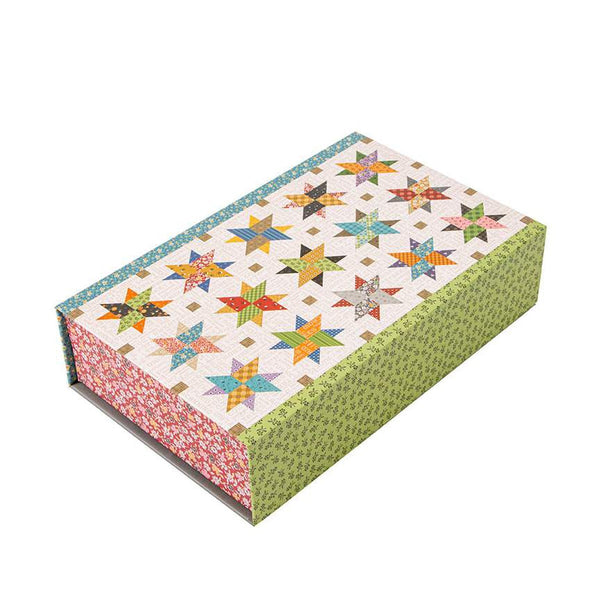 Image of the Lori Holt Autumn Skies Runner Quilt Kit. Image depicts a star pattern runner with blue, green, red, and yellow.
Cute Little Fabric Shop