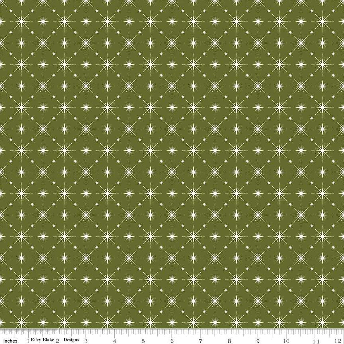 Image of Christmas Is in Town Stars Green by Riley Blake Designs. Features arranged sparkle stars on a green background. 
Cute Little Fabric Shop