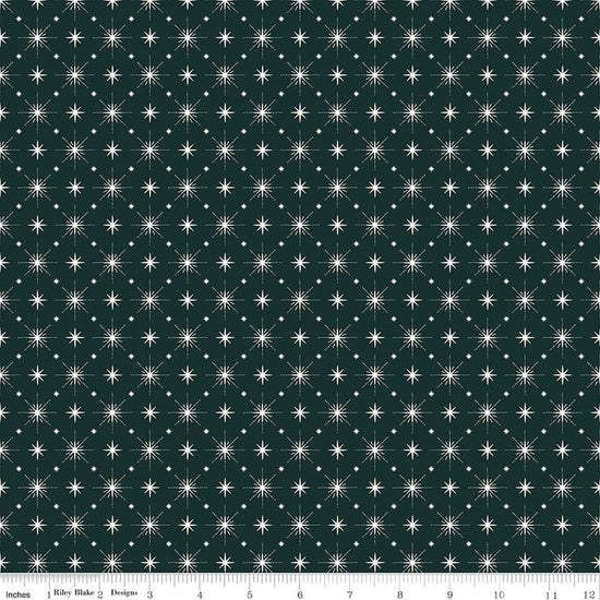 Image of Christmas Is in Town Stars Forest by Riley Blake Designs. Features arranged sparkle stars on a dark green background. 
Cute Little Fabric Shop