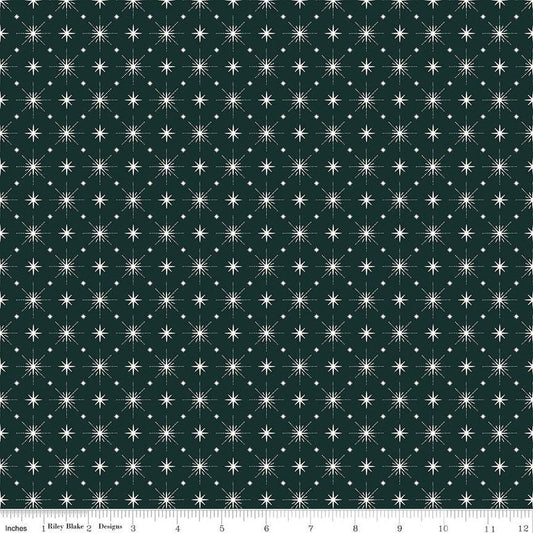 Image of Christmas Is in Town Stars Forest by Riley Blake Designs. Features arranged sparkle stars on a dark green background. 
Cute Little Fabric Shop