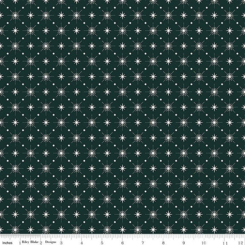 Image of Christmas Is in Town Stars Forest by Riley Blake Designs. Features arranged sparkle stars on a dark green background. 
Cute Little Fabric Shop