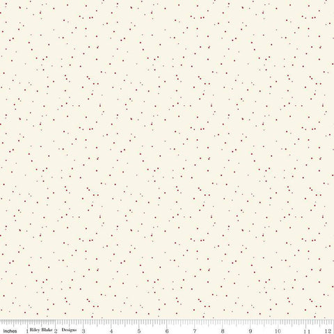 Creamquilting cotton fabric with small dark red speckled dots. 
Cute Little Fabric Shop