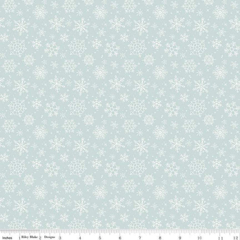 Image of the Magical Winterland Snowflake Blue quilting cotton fabric by Riley Blake Designs. Features scattered snowflakes on a blue background. 
Cute Little Fabric Shop