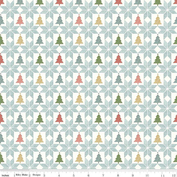 Image of the Magical Winterland Patchwork Multi quilting cotton fabric by Riley Blake Designs. Features a quilt design with trees and stars on a light blue background. 
Cute Little Fabric Shop