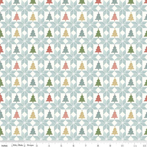 Image of the Magical Winterland Patchwork Multi quilting cotton fabric by Riley Blake Designs. Features a quilt design with trees and stars on a light blue background. 
Cute Little Fabric Shop