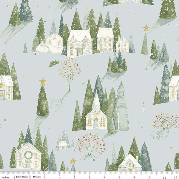 Image of the Magical Winterland Home Sweet Home Main Blue quilting cotton fabric by Riley Blake Designs. Features houses, trees, and snowflakes on a blue background. 
Cute Little Fabric Shop