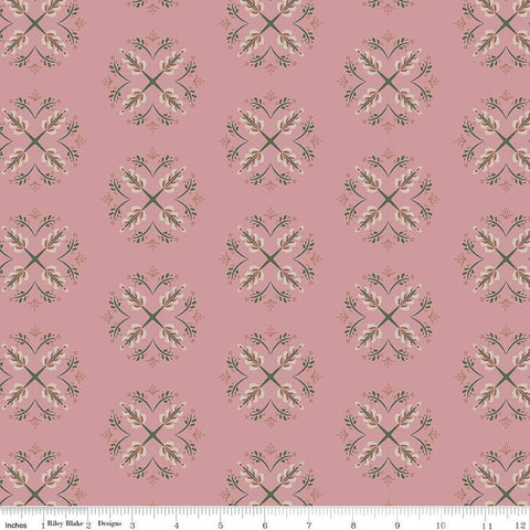 Rose, dusty pink colored fabric with geometric flowers leaves, and stems. 
Cute Little Fabric Shop