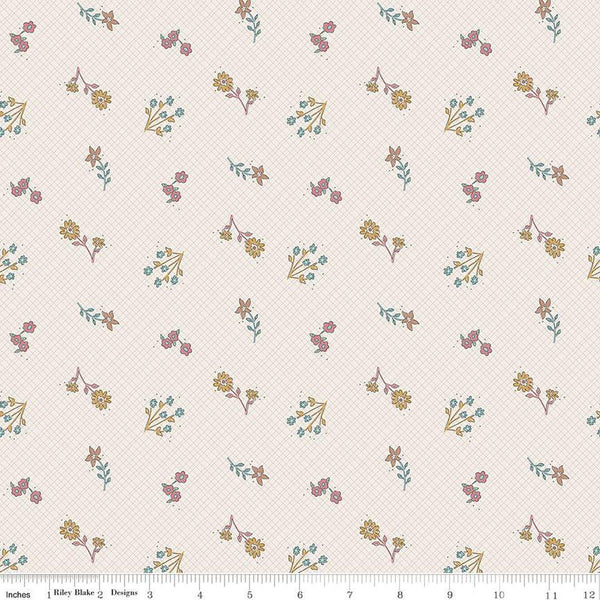 Cream, linen colored fabric with light grid lines on the background and scattered yellow, teal, and pink flowers. 
Cute Little Fabric Shop