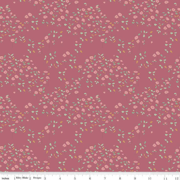 Rose, dark pink colored fabrics with clusters of pink flowers with green stems and leaves. 
Cute Little Fabric Shop