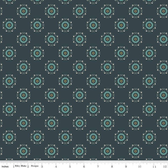 Navy, ink, night colored quilting cotton fabric with circular floral wreathes that are light teal, yellow, and white. 
Cute Little Fabric Shop