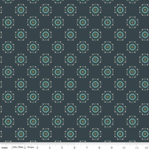 Navy, ink, night colored quilting cotton fabric with circular floral wreathes that are light teal, yellow, and white. 
Cute Little Fabric Shop