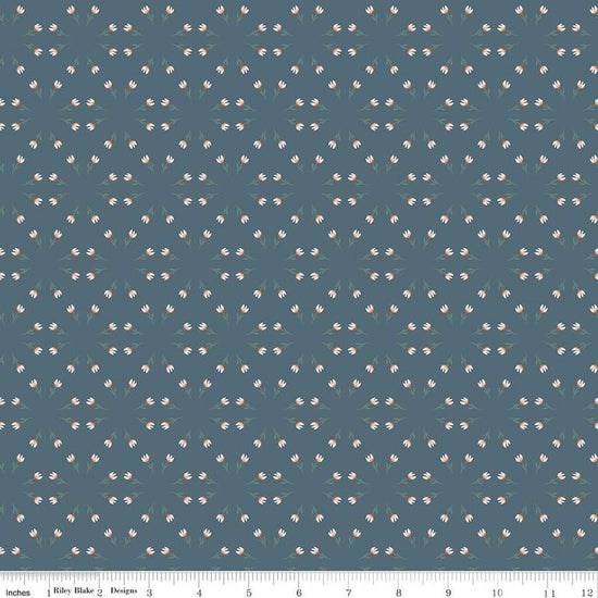 Blue, navy, ink colored quilting cotton fabric with clusters of scattered white tulips. 
Cute Little Fabric Shop