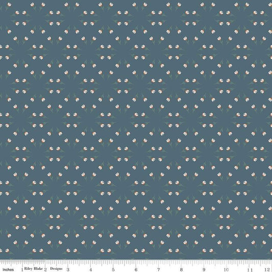 Blue, navy, ink colored quilting cotton fabric with clusters of scattered white tulips. 
Cute Little Fabric Shop