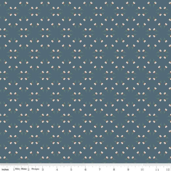Blue, navy, ink colored quilting cotton fabric with clusters of scattered white tulips. 
Cute Little Fabric Shop